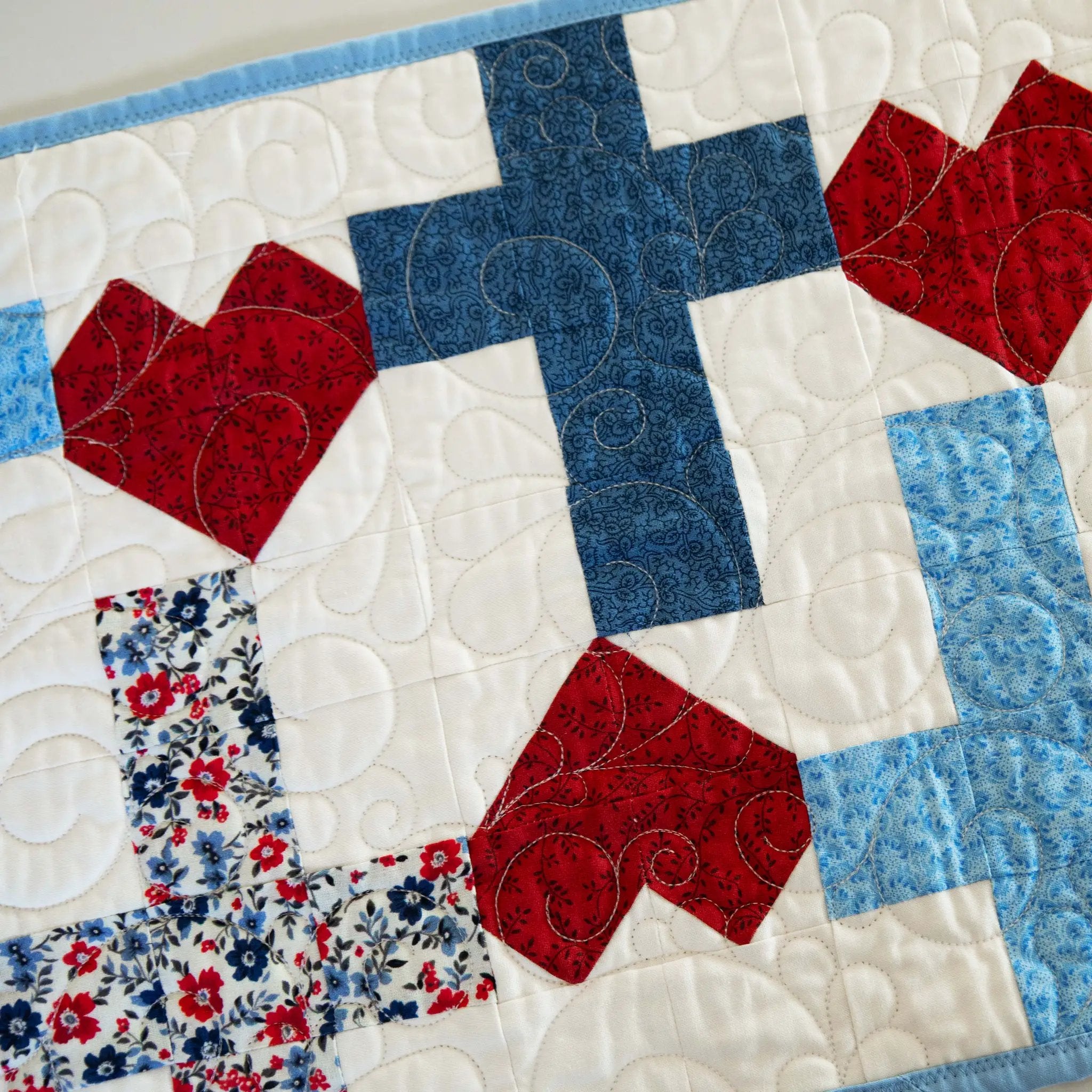 Quilt kit table runner: God Bless America Crosses and Hearts by Block Party Quilt Co, blue, red and white patchwork.