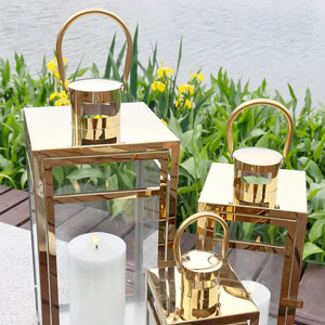 Set of 3 gold stainless steel decorative candle lanterns (12, 15, 19 in) by JHY DESIGN