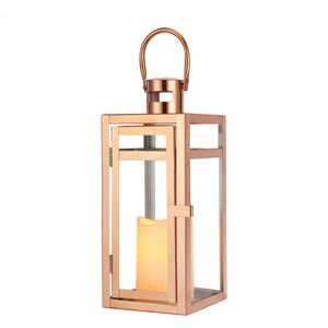 12'' high rose gold metal decorative candle lantern with glass sides; hangs or sits for display, candle glow inside.