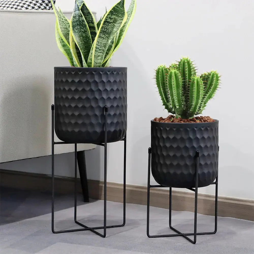 Flower pots set: 2 black metal pots with stands, textured hammered finish, 12" and 18" heights.