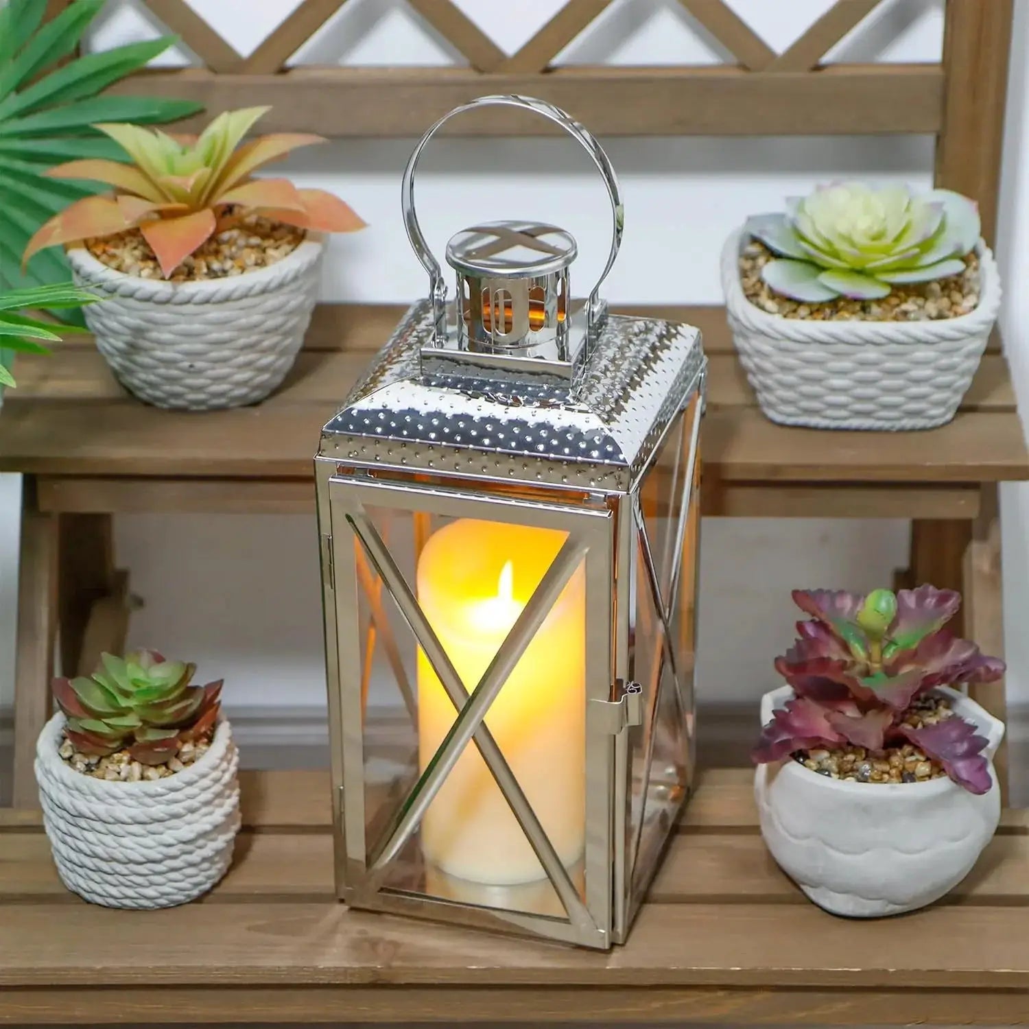 14-inch square stainless steel decorative candle lantern by JHY DESIGN with a warm glow