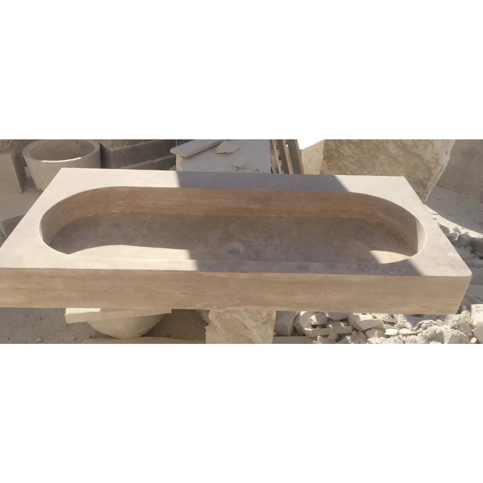Light travertine natural stone basin sink for bathroom, oval bowl on white vanity countertop