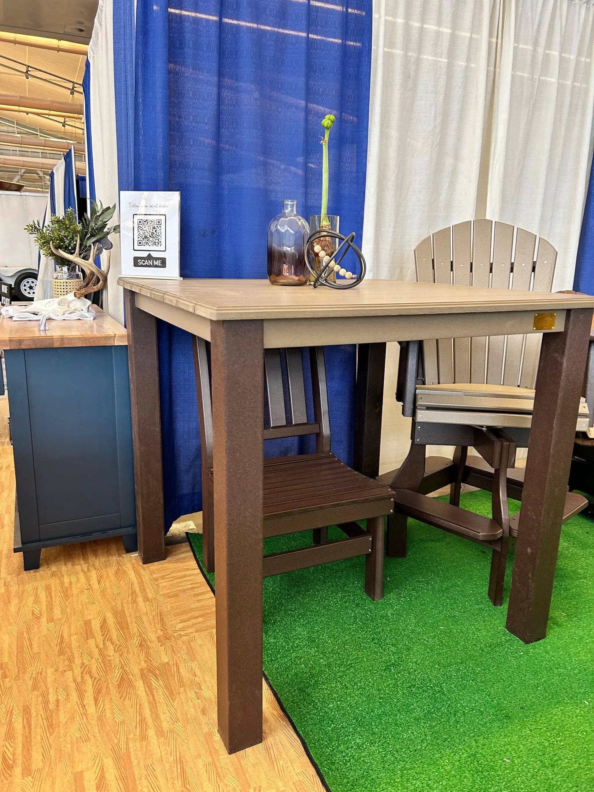 Post Leg Outdoor Counter Height Table with dark brown legs and light brown top, shown in a booth.
