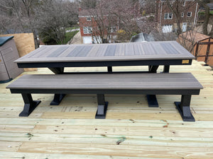 Trestle X Outdoor Bench by Wooden Whale Workshop, gray-stained wood with black trestle legs.