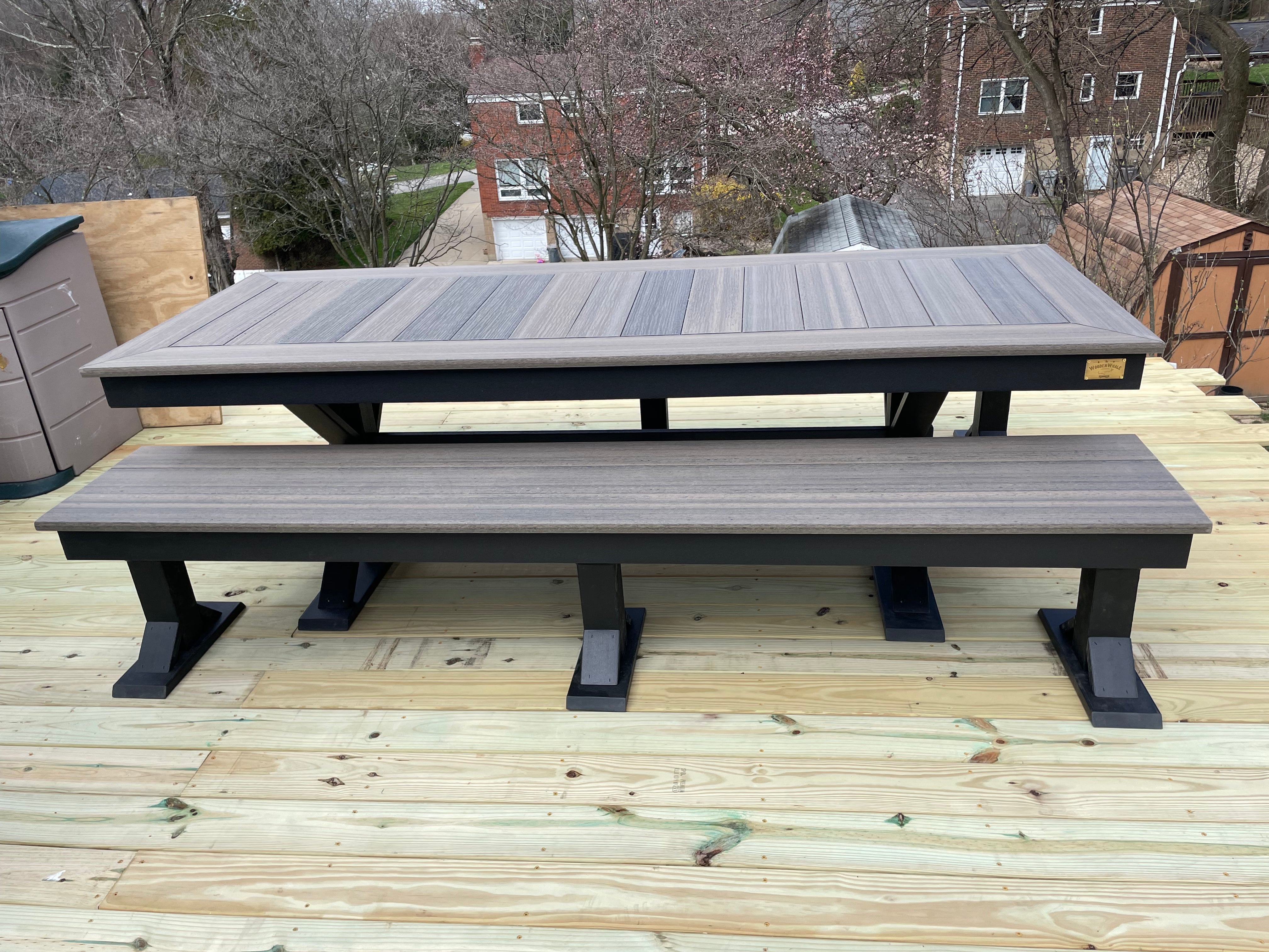 Trestle X Outdoor Bench by Wooden Whale Workshop, gray-stained wood with black trestle legs.