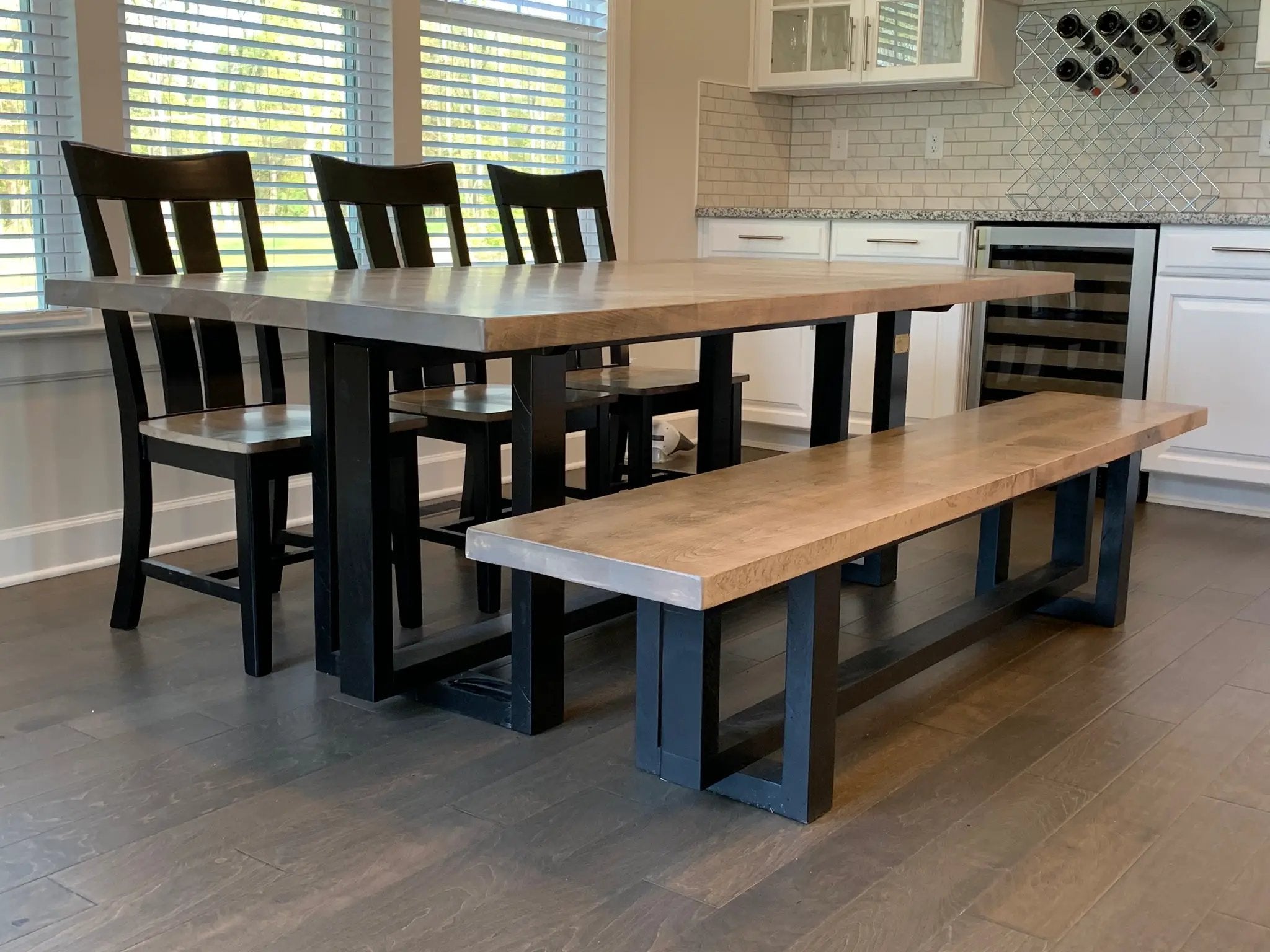 Heston Dinning Table, custom-built with a light wood top and black metal legs