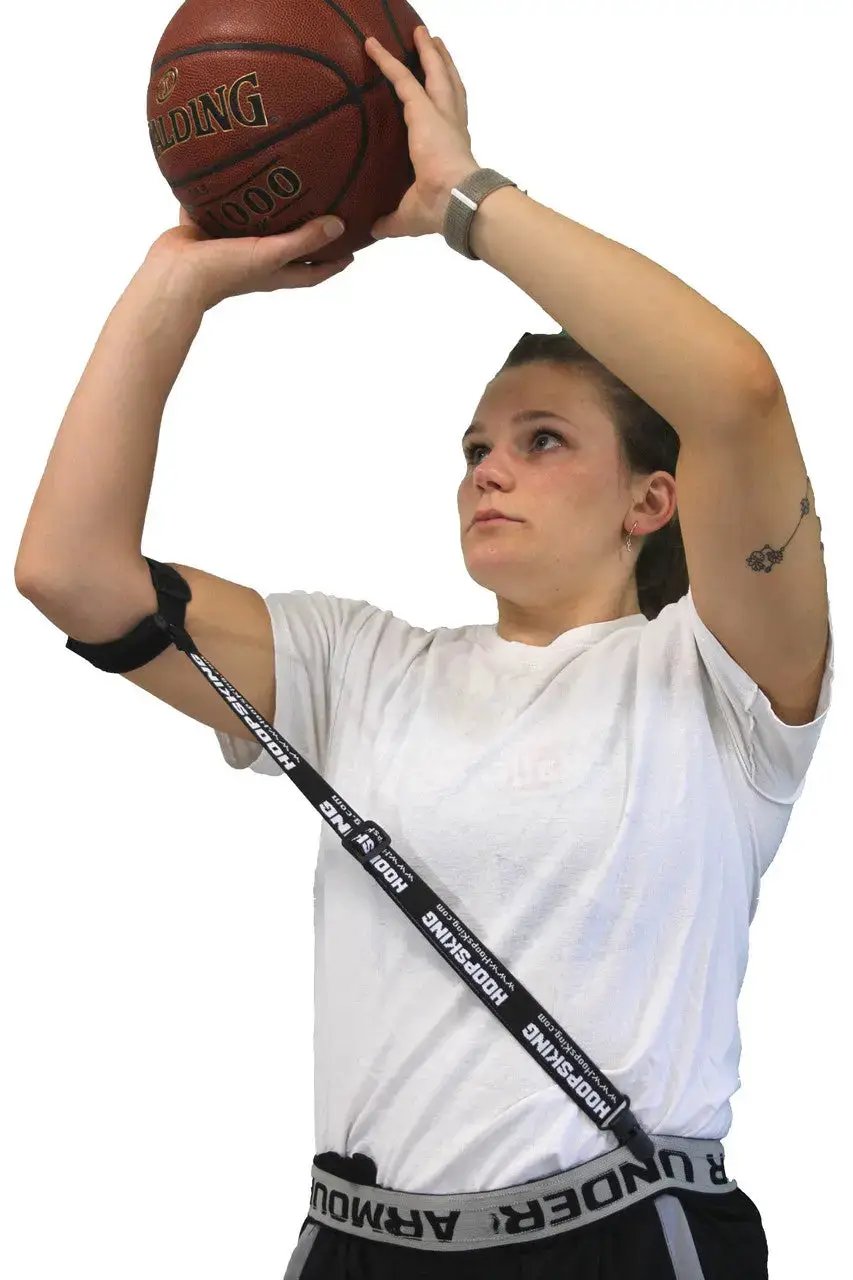 HoopsKing Straight Shooter Basketball Training Aid with a black diagonal strap worn by a player while shooting