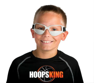 HoopsKing basketball dribble goggles worn by a smiling boy; white goggles with black straps and HoopsKing logo on shirt