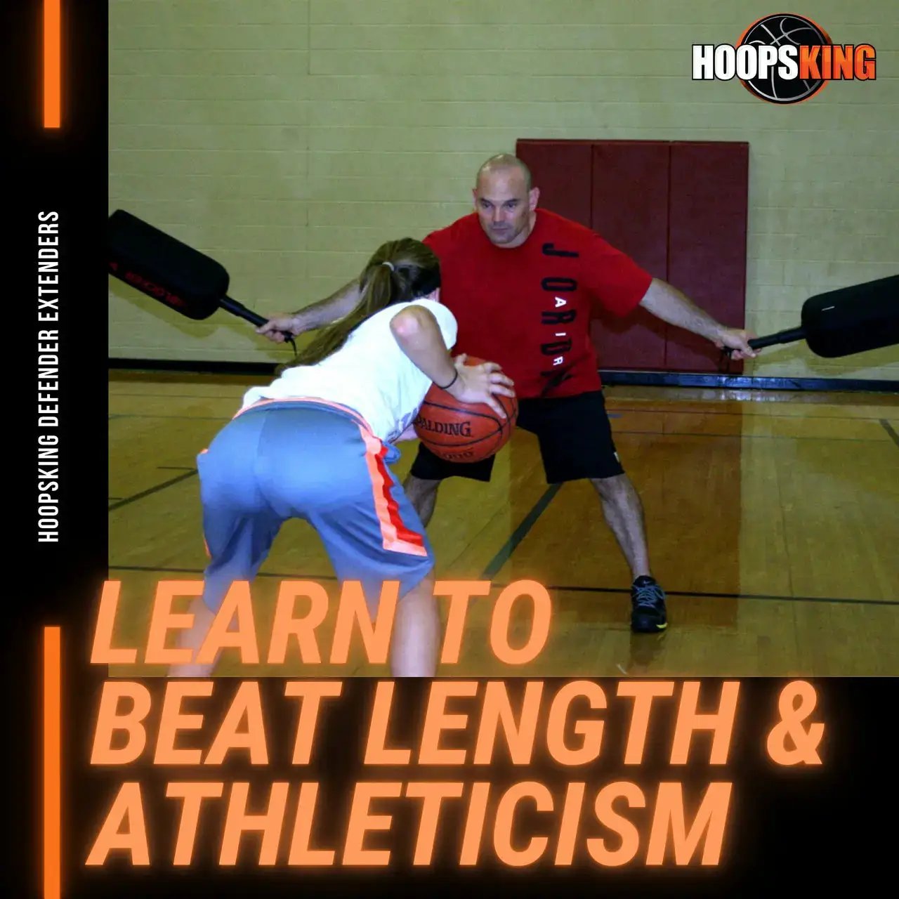 Defender Extender Basketball Training Pads by HoopsKing; two black training pads shown in use during a gym drill