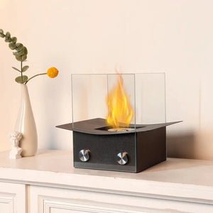 8-inch portable tabletop fireplace by JHY DESIGN with black metal base and clear glass windscreen panels.