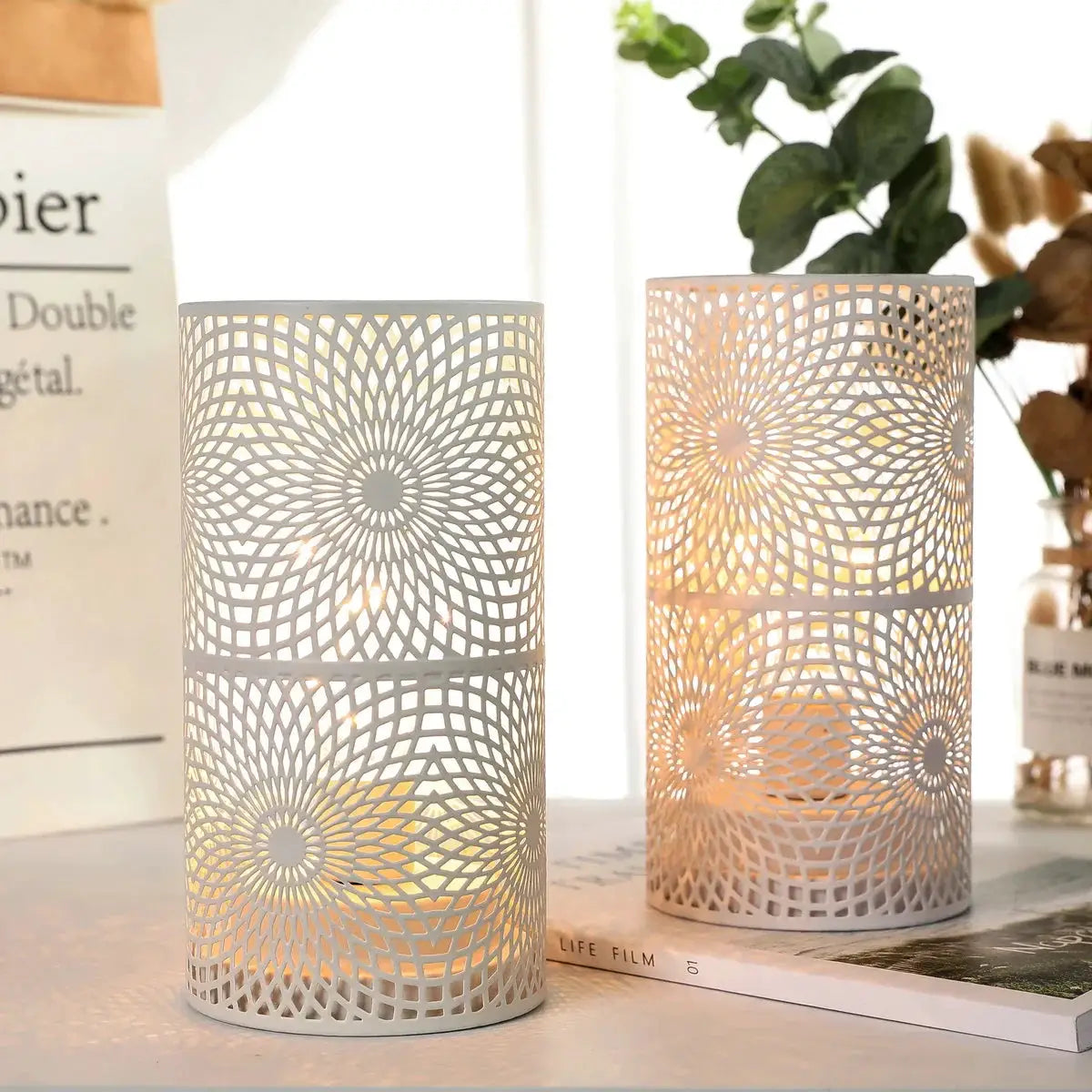 Battery Powered Table Lamps Set of 2, white metal mesh cylindrical lamps with intricate circular lattice and warm light.