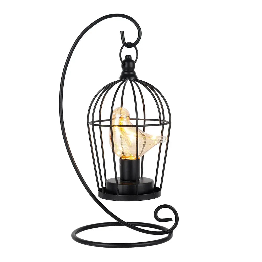 JHY DESIGN 12in tall battery-operated birdcage lamp, black metal cage with glowing bird on a curved stand