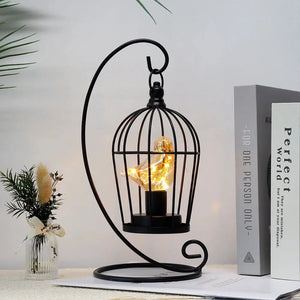 12-inch tall battery-operated birdcage lamp by JHY DESIGN in black metal with warm LED bulb