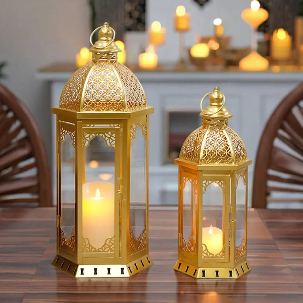 Decorative lanterns, set of 2 metal candle lanterns in gold/brass with intricate lattice panels; 22in and 17in tall.