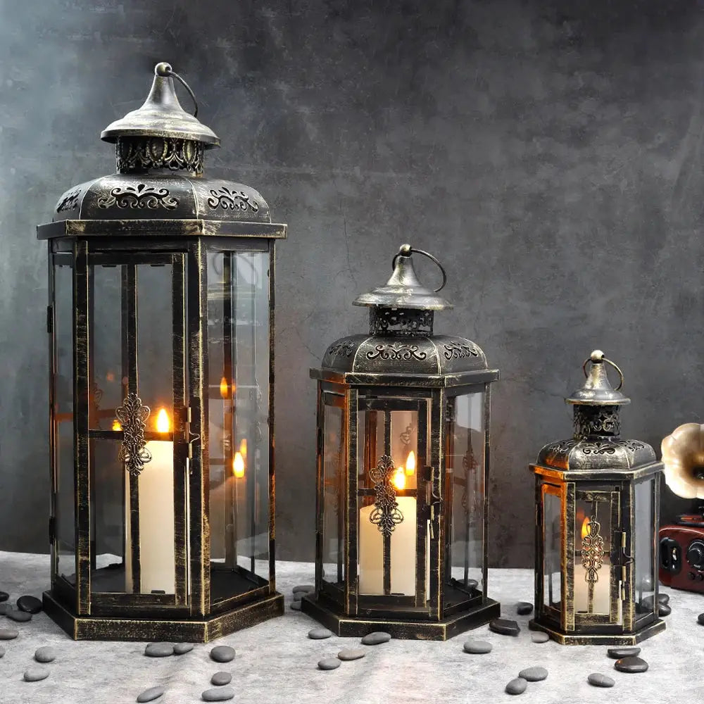 Set of 3 black lanterns with gold brush detailing, vintage metal frames and glass panels (20.5in, 14in, 10in tall)