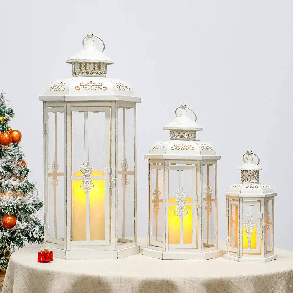 Set of 3 white metal candle lanterns with gold brush accents in 20in, 14in, and 10in sizes