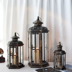 Set of 3 vintage metal decorative candle lanterns, black with gold brush accents, sizes 20.5, 14, and 10 inches by JHY DESIGN.