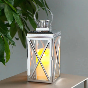 14-inch tall square stainless steel candle lantern by JHY DESIGN with glass panels and a circular top handle.