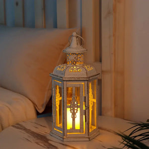 10 inch high vintage style hanging lantern metal candleholder, distressed white with ornate scrollwork and warm glow