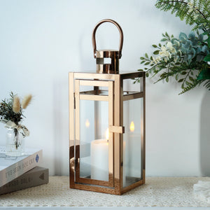 12'' High rose-gold metal decorative candle lantern with glass panels and hanging handle by JHY DESIGN