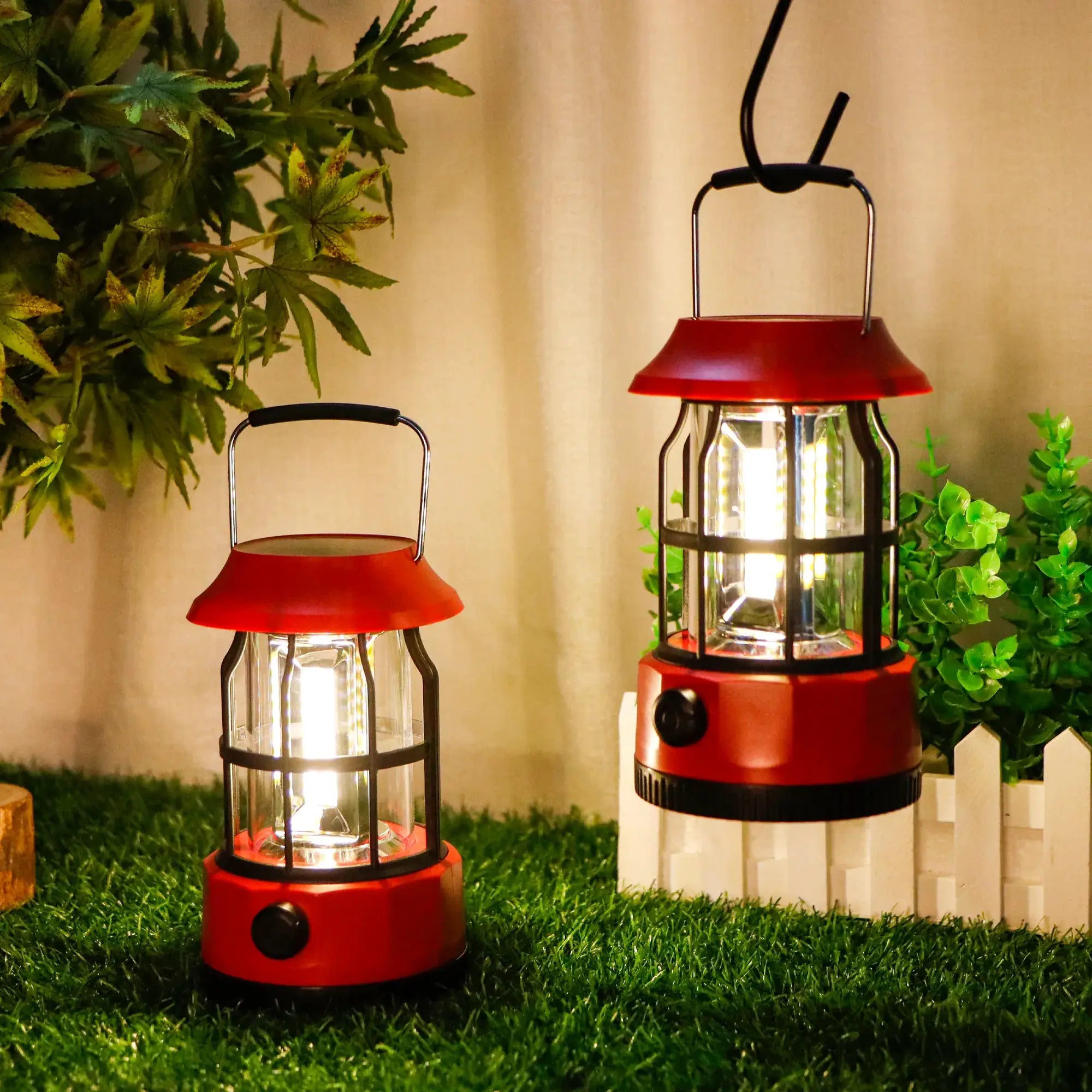 Set of 2 red LED solar camping lanterns with dimmable brightness.