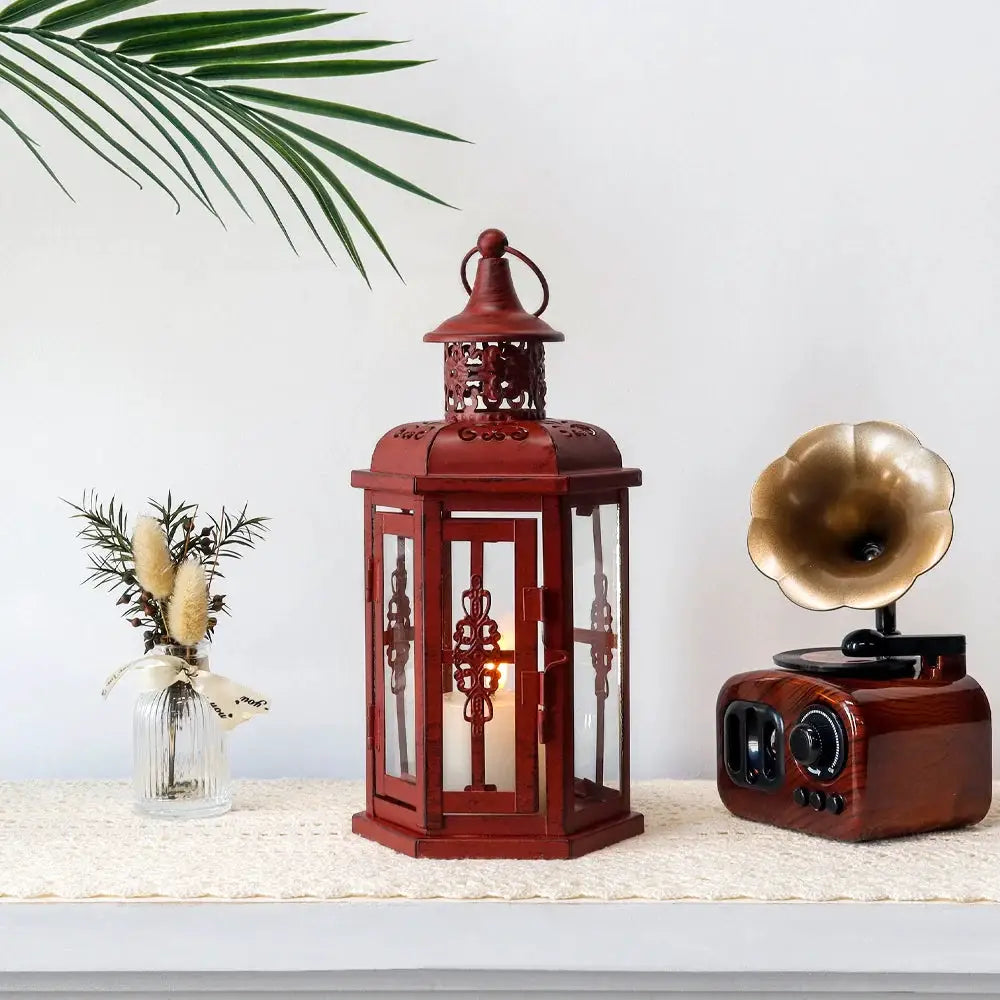 10H Vintage Hanging Lantern red metal candle lantern with glass panels, ornate lattice top and loop handle.