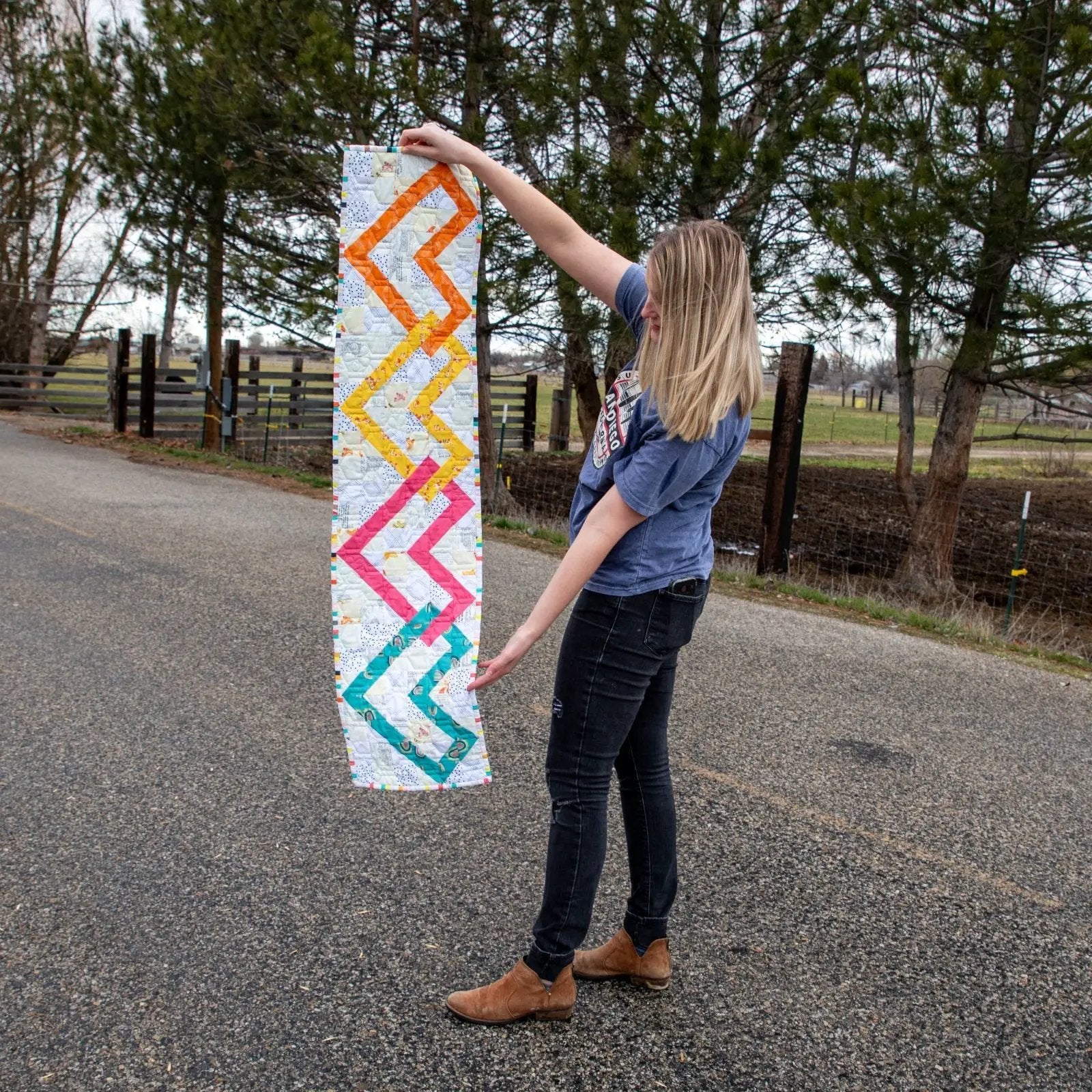 Linked Hearts Quilted Table Runner Pattern by Block Party Quilt Co, colorful zigzag hearts on fabric.