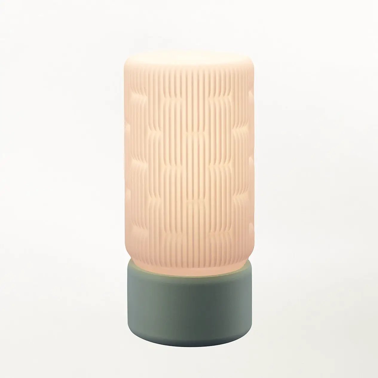 Liunk Table Lamp featuring a pink ribbed shade with vertical grooves and a teal cylindrical matte base.