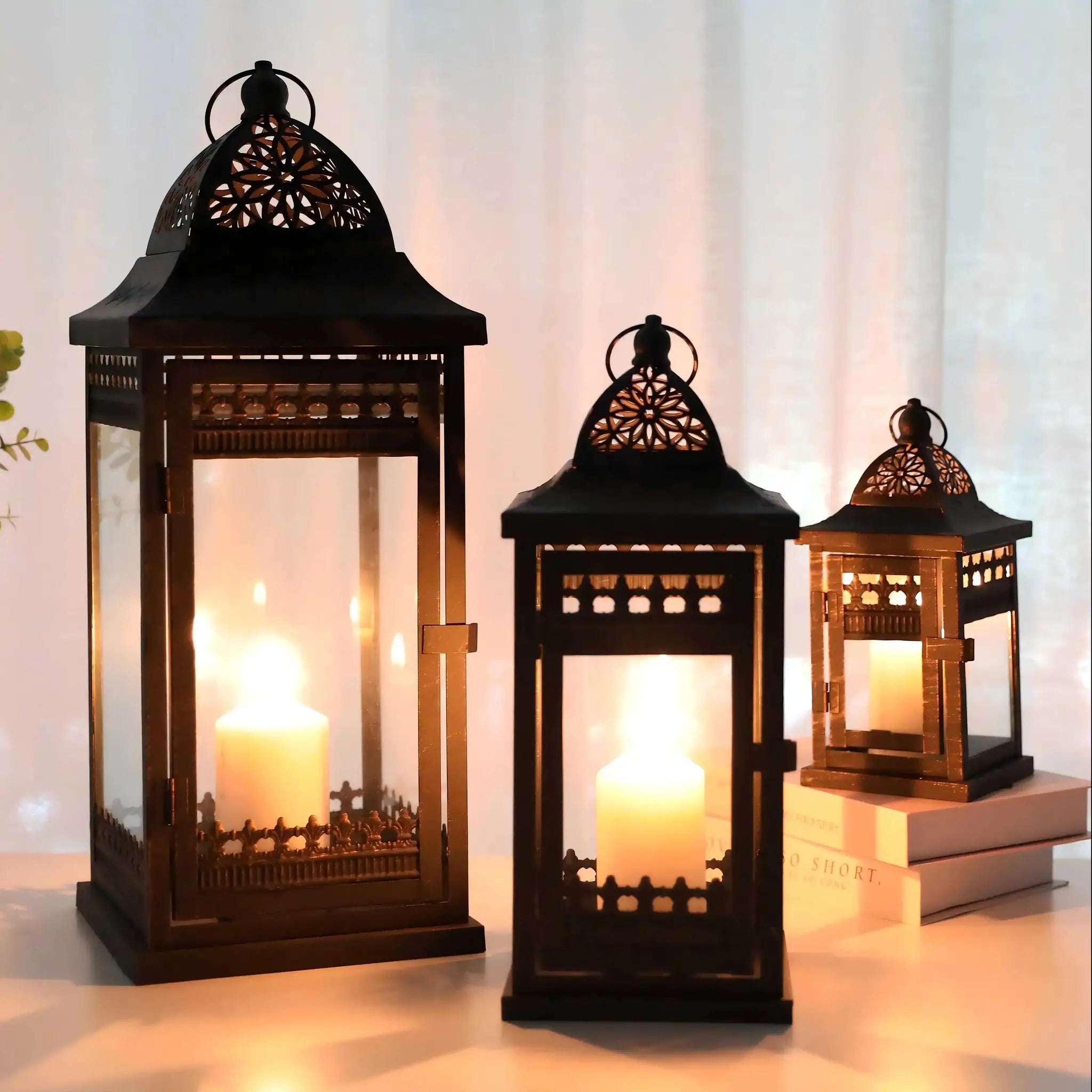JHY DESIGN decorative candle lanterns set of 3 in black metal with intricate lattice panels and warm glow