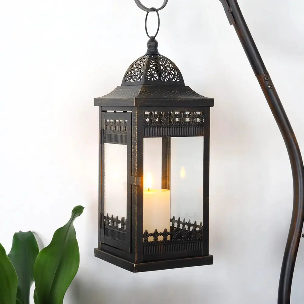 Decorative candle lanterns set of 3: black metal hanging lanterns with glass panes and ornate lattice.