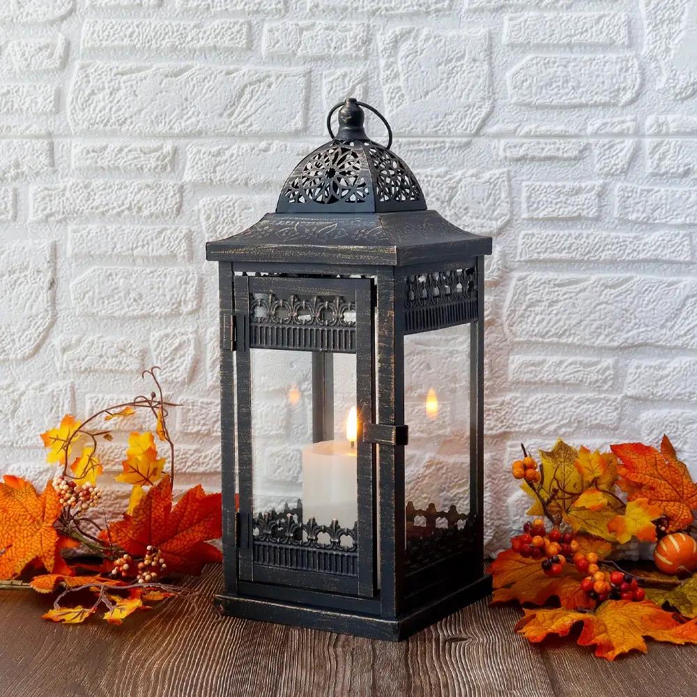 JHY DESIGN decorative candle lantern, black metal with glass panes and ornate lattice, lit candle inside
