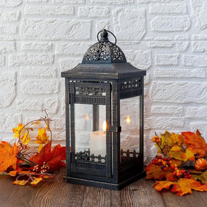 JHY DESIGN decorative candle lantern, black metal with glass panes and ornate lattice, lit candle inside