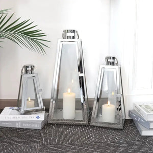 JHY DESIGN 3-piece chrome stainless steel lantern set with glass panels; 21", 16", 11" tall with candles.