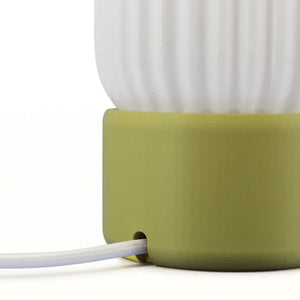 Milk Shade Barrel Table Lamp with lime green base and white fabric shade, cord visible