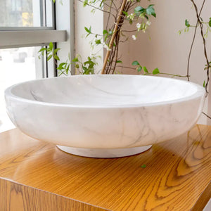 Calacatta white marble vessel sink by Villohome, round polished bathroom sink for above-vanity installation.