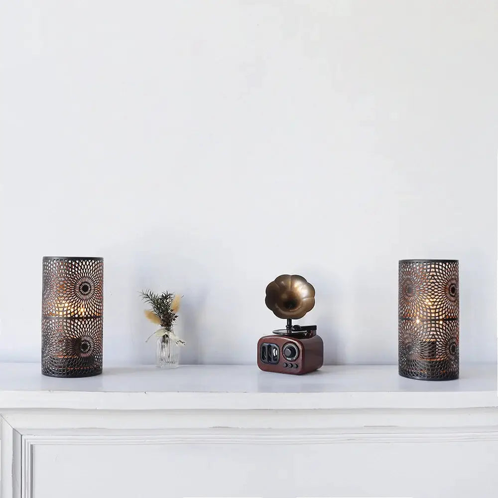 Set of 2 black metal battery-operated table lamps with intricate perforated lattice pattern.