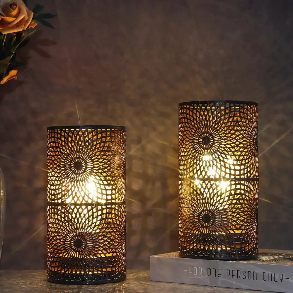 Table lamps set of 2 in black metal with an intricate circular perforated pattern; battery-operated by JHY DESIGN