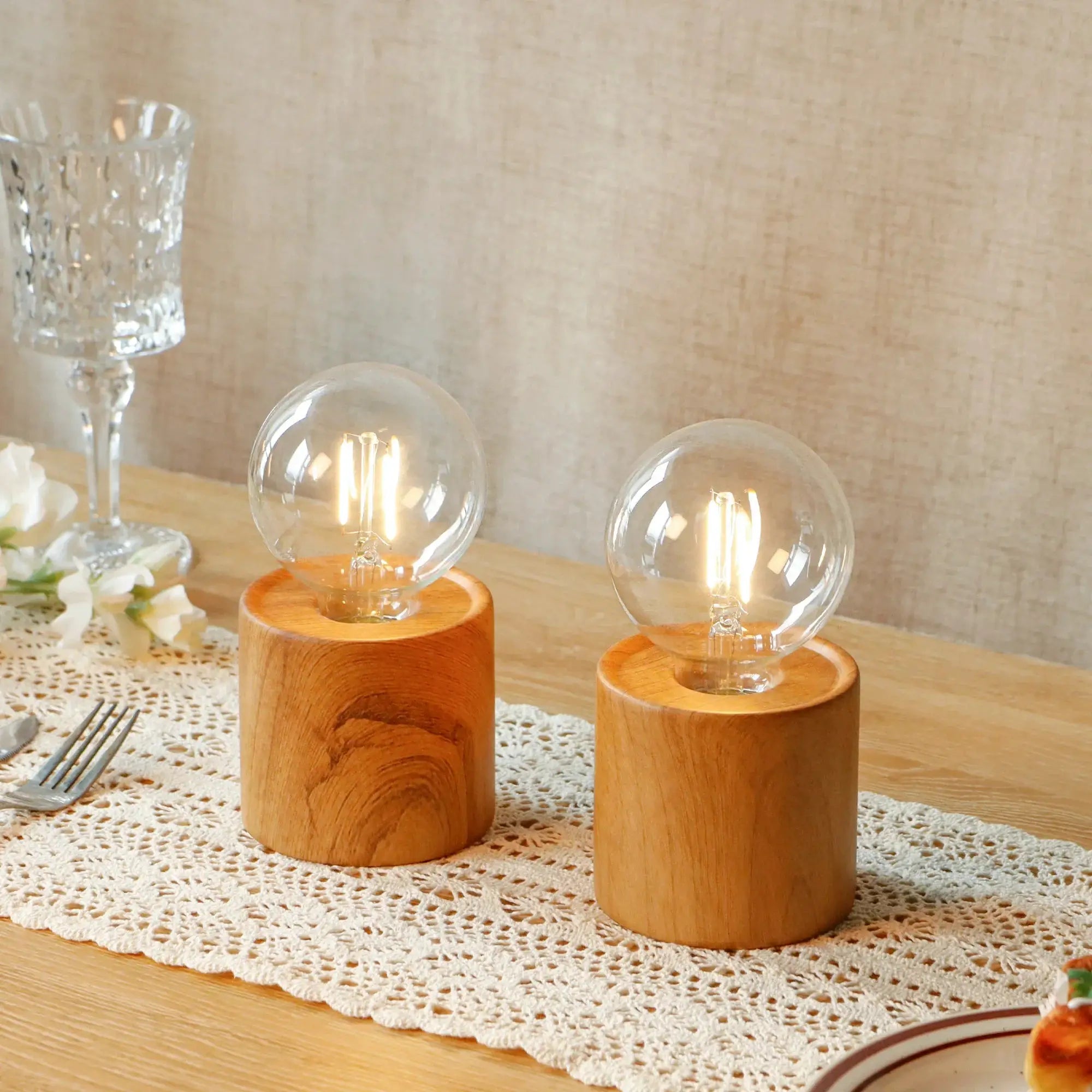 Set of 2 wood-grain battery-operated table lamps with clear glass bulbs on wooden bases