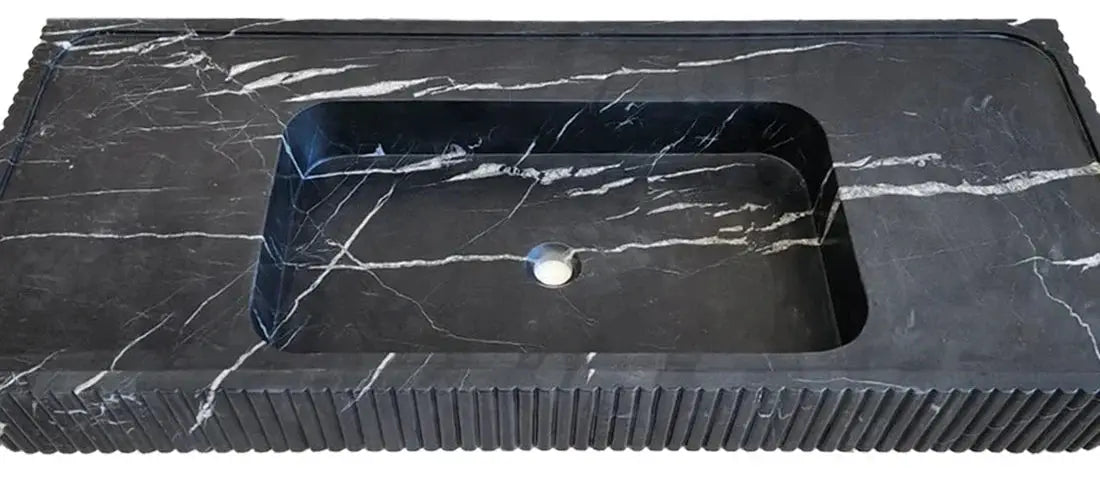 Nero Marquina marble wall-mount bathroom vanity sink with a fluted front