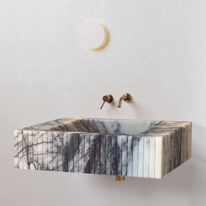 New York Marble Wall-mount Bathroom Sink by Villohome; white/gray veined marble with brass fixtures.