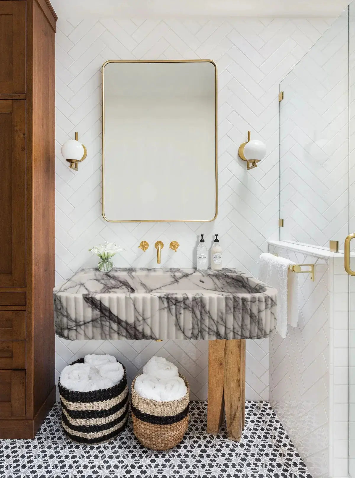 New York Marble wall-mount vessel sink by Villohome, ribbed textured white-gray marble with gold fixtures