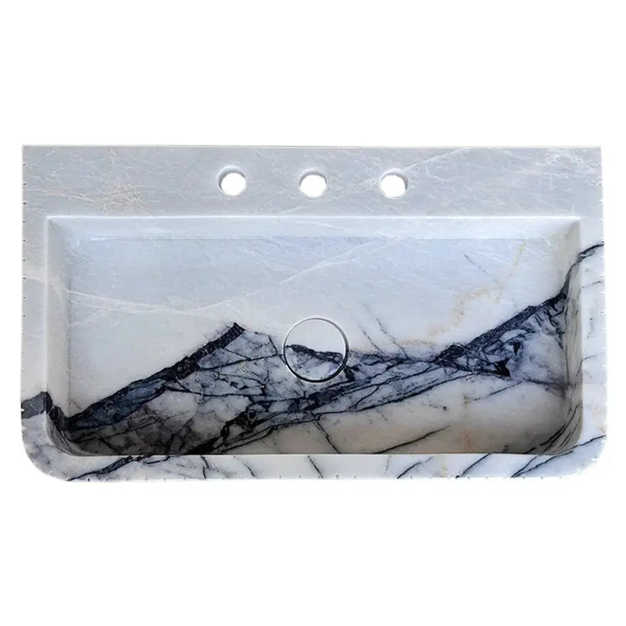 New York Marble wall-mount bathroom sink with fluted front and edges; white with dark veining.