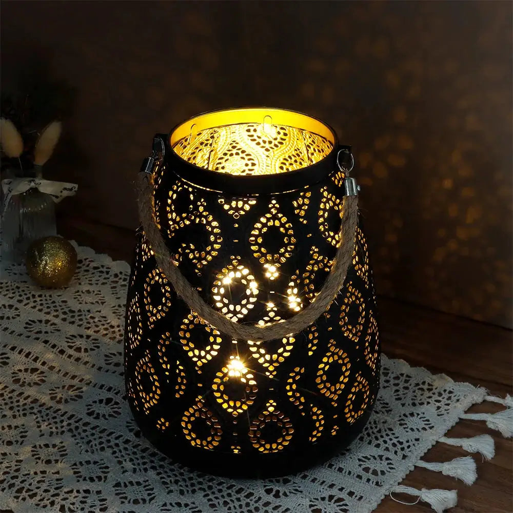 8''H Moroccan metal lamp, black with gold brush pattern, battery-operated lantern with rope handle and warm glow