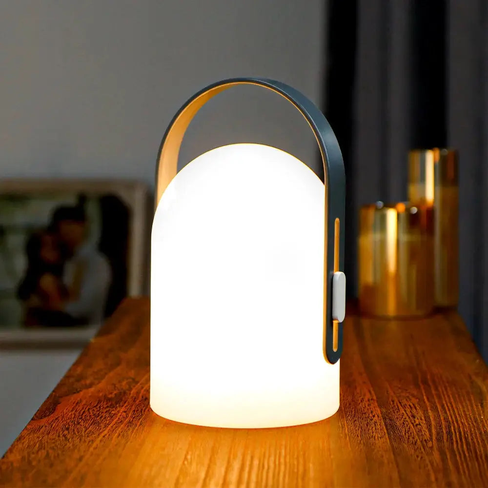 4000mAh portable outdoor rechargeable table lamp by JHY DESIGN; frosted white glass with gray frame.