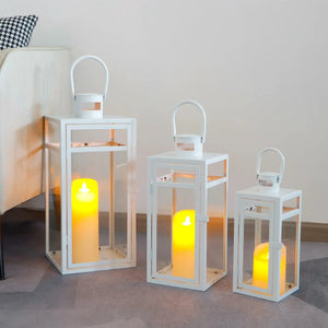 Set of 3 white metal candle lanterns with glass panels and arched handles (12/15/19 in).