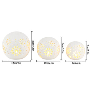 Set of 3 white ceramic decorative lamps by JHY DESIGN, battery-operated with carved floral perforations.