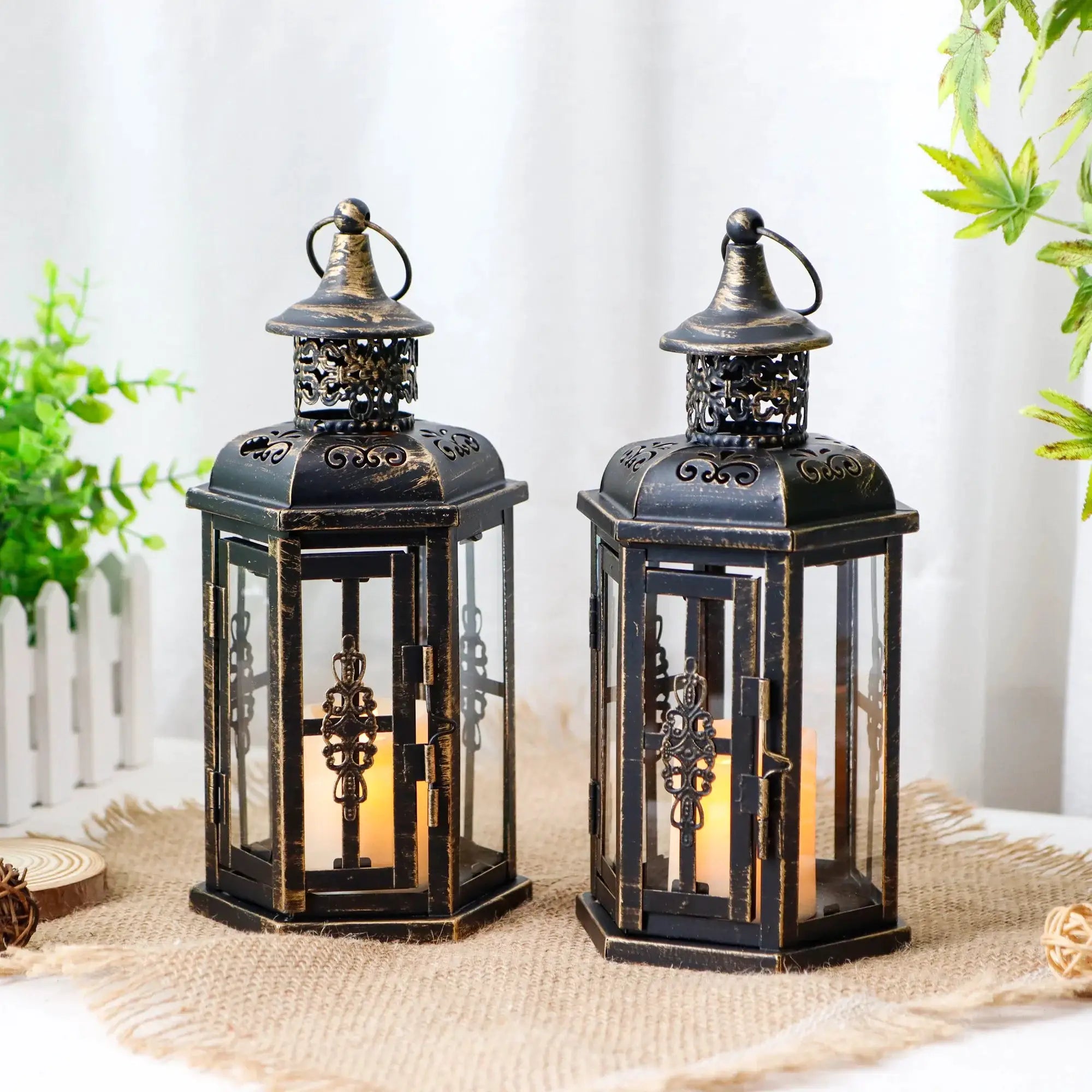 Decorative candle lanterns, set of 2, 10-inch vintage-style hanging lanterns in distressed black metal with cutouts.