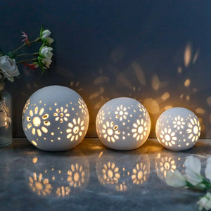Set of 3 white ceramic decorative lamps with floral cutouts; battery-operated by JHY DESIGN