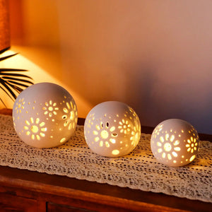 Set of 3 white ceramic decorative lamps with carved floral perforations, warm glow, 5 inches tall, battery powered