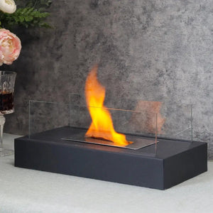Square tabletop fire bowl pot by JHY DESIGN with two-sided glass panels on a black base.